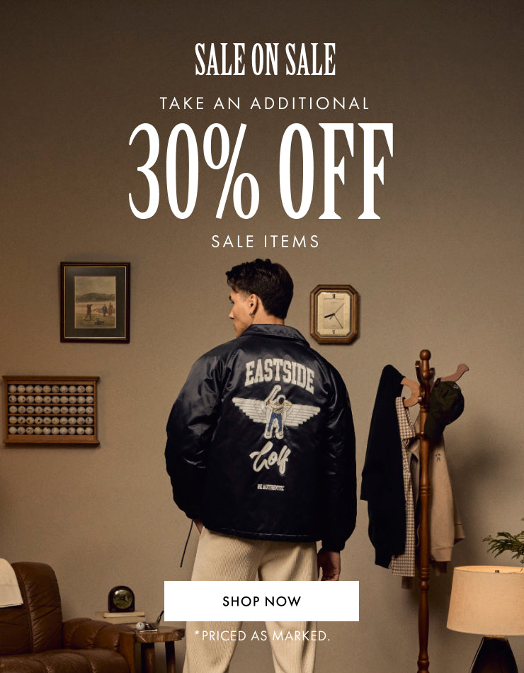 Person wearing a black jacket with 'Eastside' branding, promotional text for sale on a brown background.