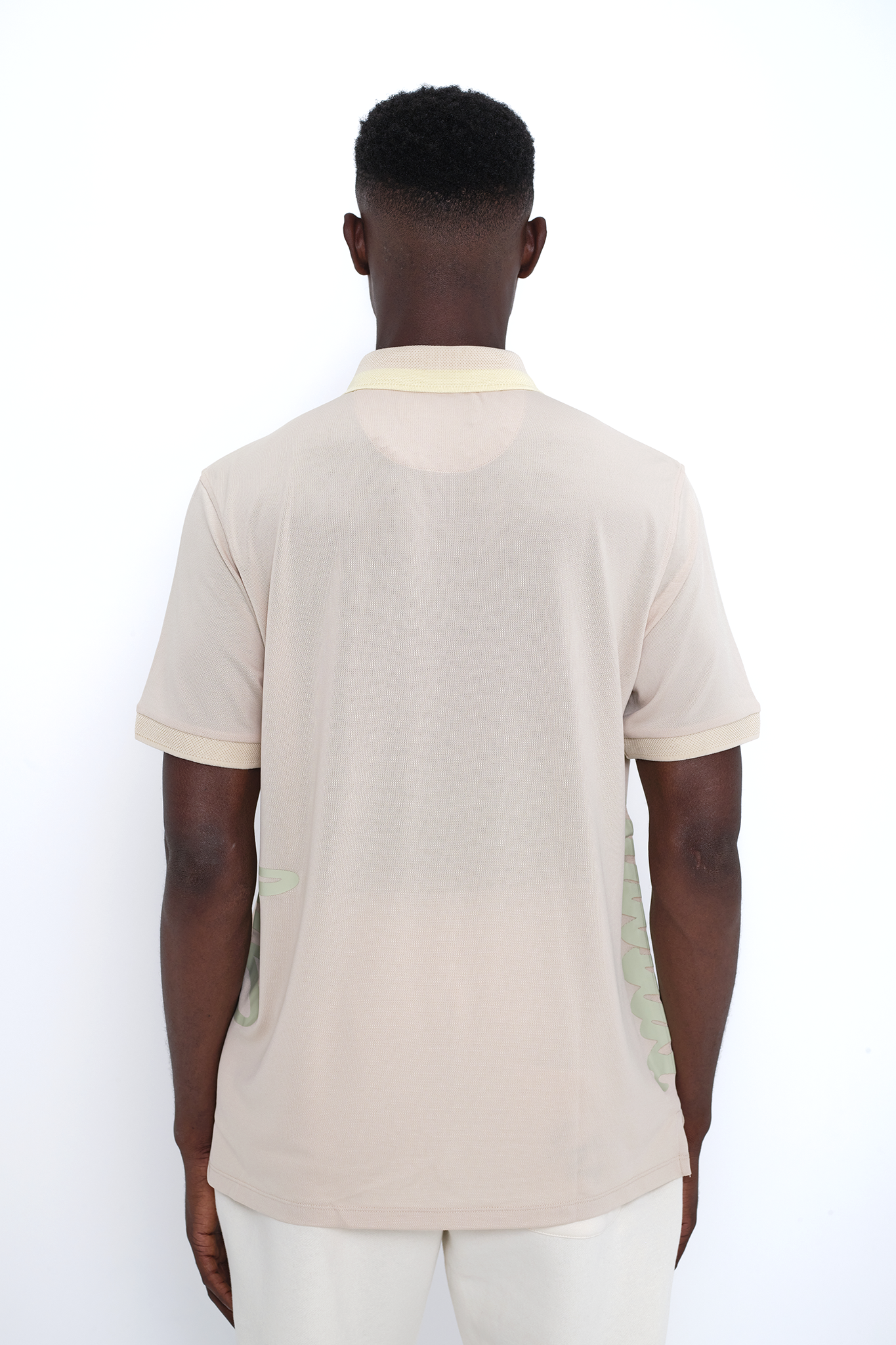Frosted Almond Eastside Golf Follow Through Polo Shirt