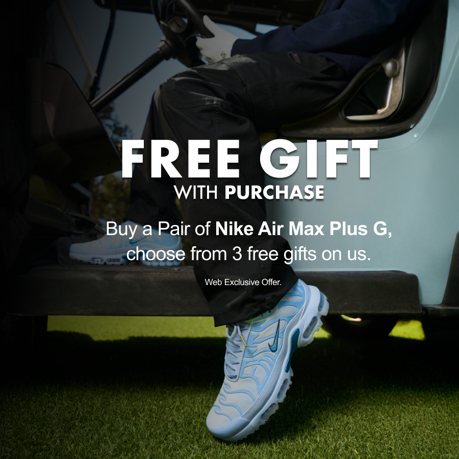 Promotional banner featuring a person stepping out of a light blue vehicle onto grass, wearing Nike Air Max Plus G sneakers in pale blue and teal. Text reads: Free Gift with Purchase — Buy a pair of Nike Air Max Plus G, choose from 3 free gifts on us. Web Exclusive Offer.